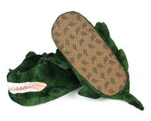 Load image into Gallery viewer, Pair of plush alligator slippers, showing the bottom of one slipper with non-slip grips on soles
