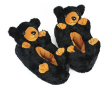 Load image into Gallery viewer, Pair of plush Black Bear Slippers with black fur, four paws, and smiling faces.
