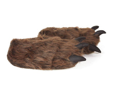 Load image into Gallery viewer, Pair of brown furry grizzly bear paw slippers with black claws, seen from the side
